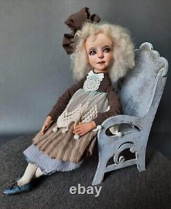 OOAK artist Alice doll on a blue chair
