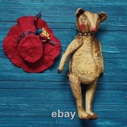 Our translation of the title 'OOAK teddy bear handmade artist collectible toy animal Melania the Bear' in French would be: 'Ourson en peluche unique fait main, œuvre d'art, jouet collectionnable, animal Melania l'ours.'